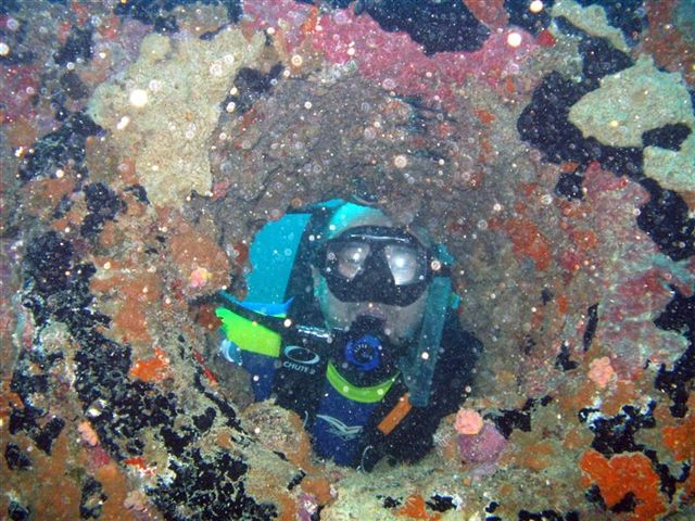 Atsushi looking through the anchor tube at American Tanker