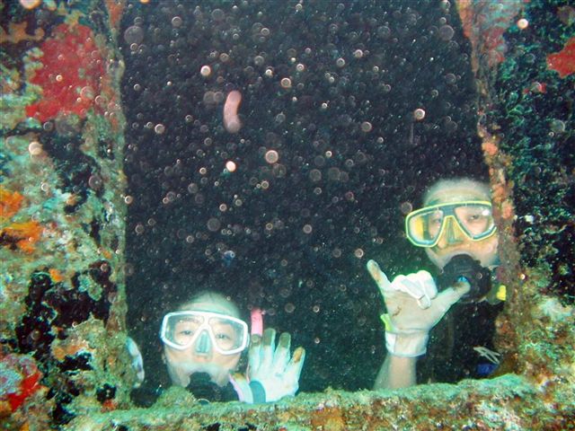 Two divers in the superstructure of the American Tanker