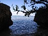 A view of the ocean between boulders near Asan, site of the US military's return to Guam in WW 2.