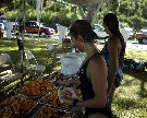 Two women getting snacks after completing the swim