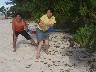 A Japanese couple enjoying the quiet beach & sun